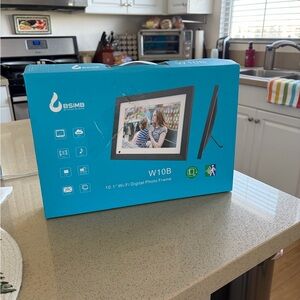 Digital Photo Frame, WIFI. 10.1”brand new. Opened box but never removed.